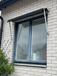 solskjerming på murhus